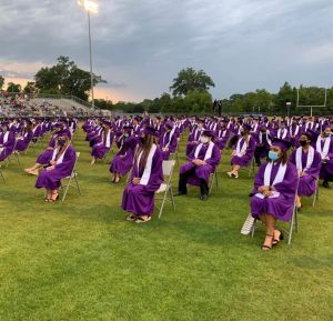 Woodlawn High School graduates sit six feet apart awaiting the ceremony to commence. (May 2020)