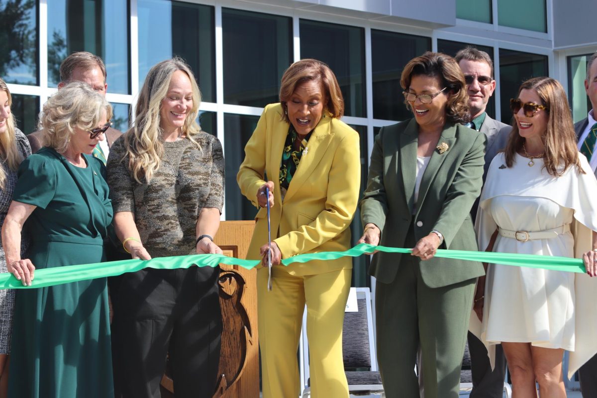 Southeastern alumna and Good Morning America co-host Robin Roberts, alongside her wife Amber Laign and university officials, cut the ribbon outside D Vickers Hall, officially opening the newly-renovated building and the Robin Roberts Media Broadcast Center.