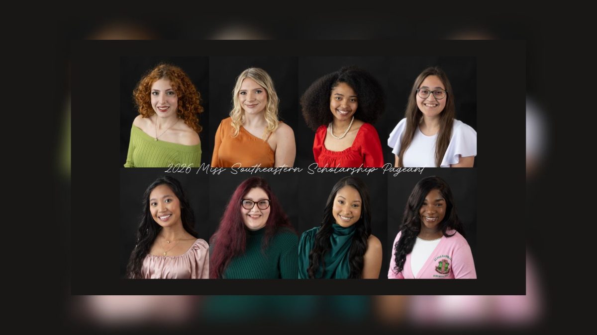 a group of women posed with a blurred black background