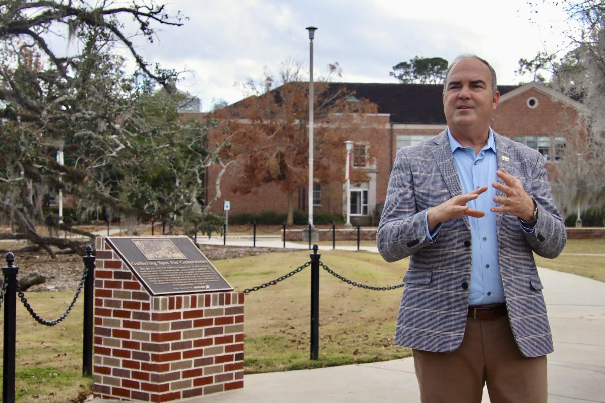 After Southeastern's accreditation, President Wainwright attended the ribbon cutting ceremony for Friendship Grove to give a five new tree samplings that were planted.