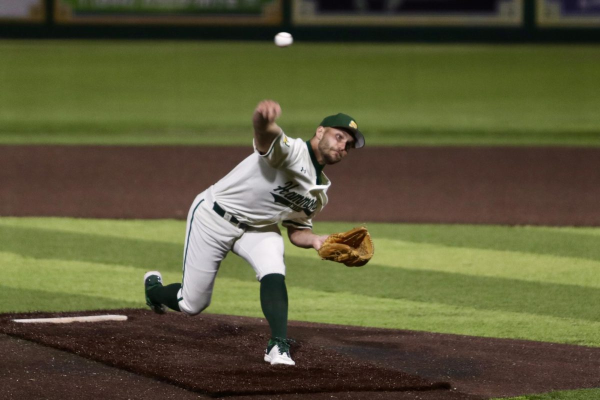a baseball player pitching the ball