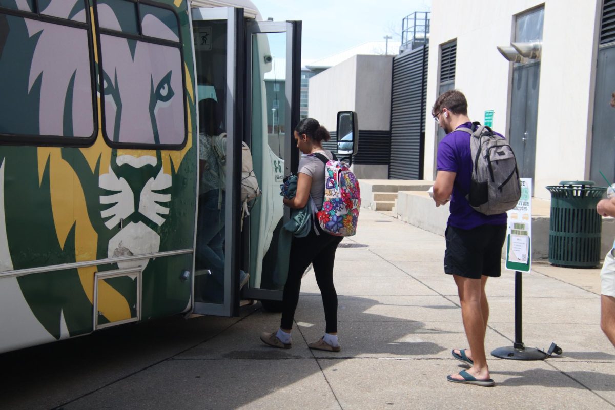 Students getting on a bus.